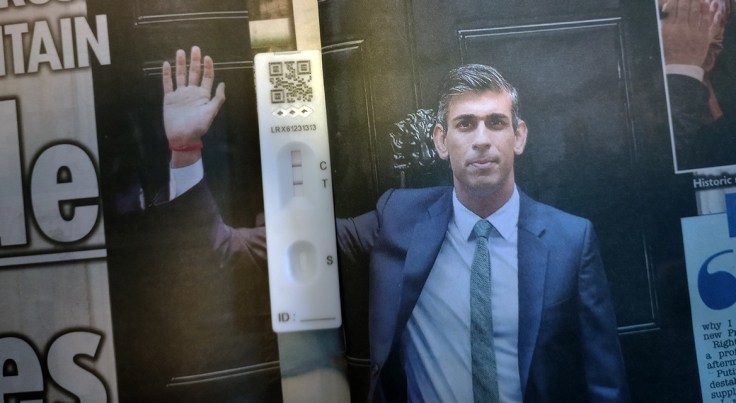 Rishi Sunak outside Number Ten, his waving arm dissected by a Covid positive lateral flow test. 